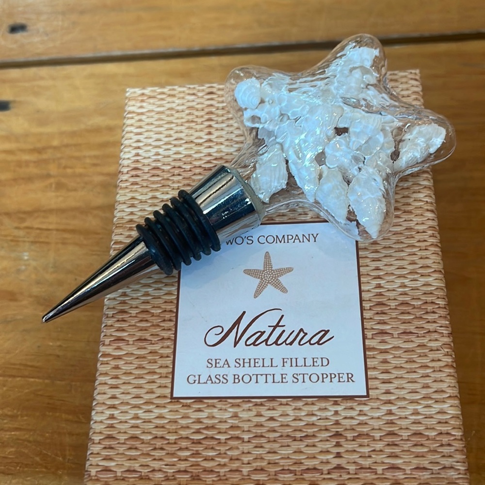 Seashell filled glass bottle stopper